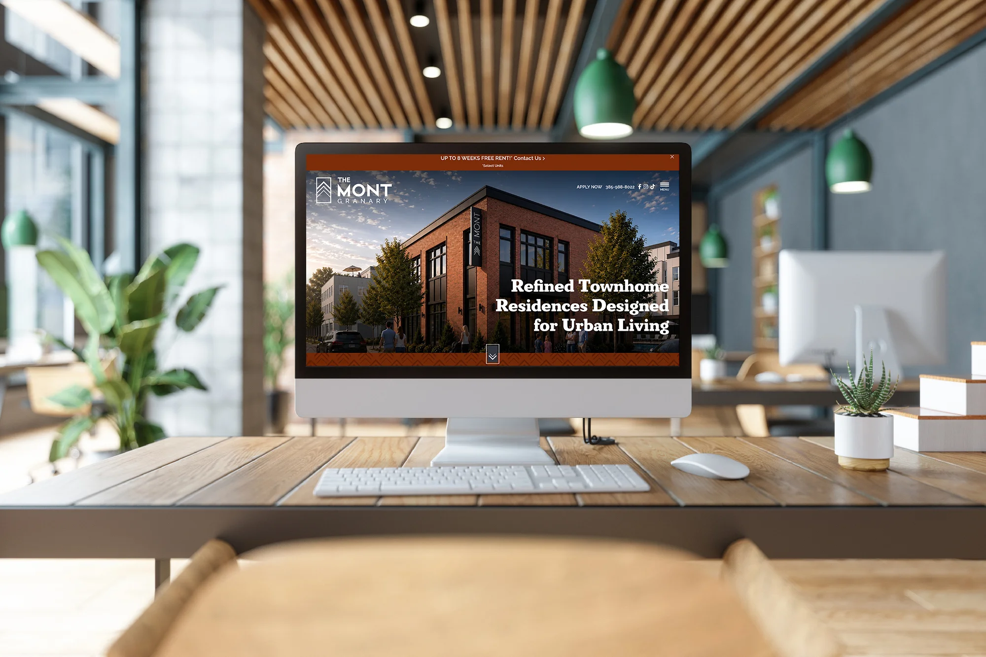 Desktop computer displaying The Mont Granary townhome residences website